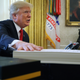 President Donald Trump talks with journalists before signing tax reform legislation into law in the Oval Office December 22, 2017 in Washington, DC. Trump praised Republican leaders in Congress for all their work on the biggest tax overhaul in decades.